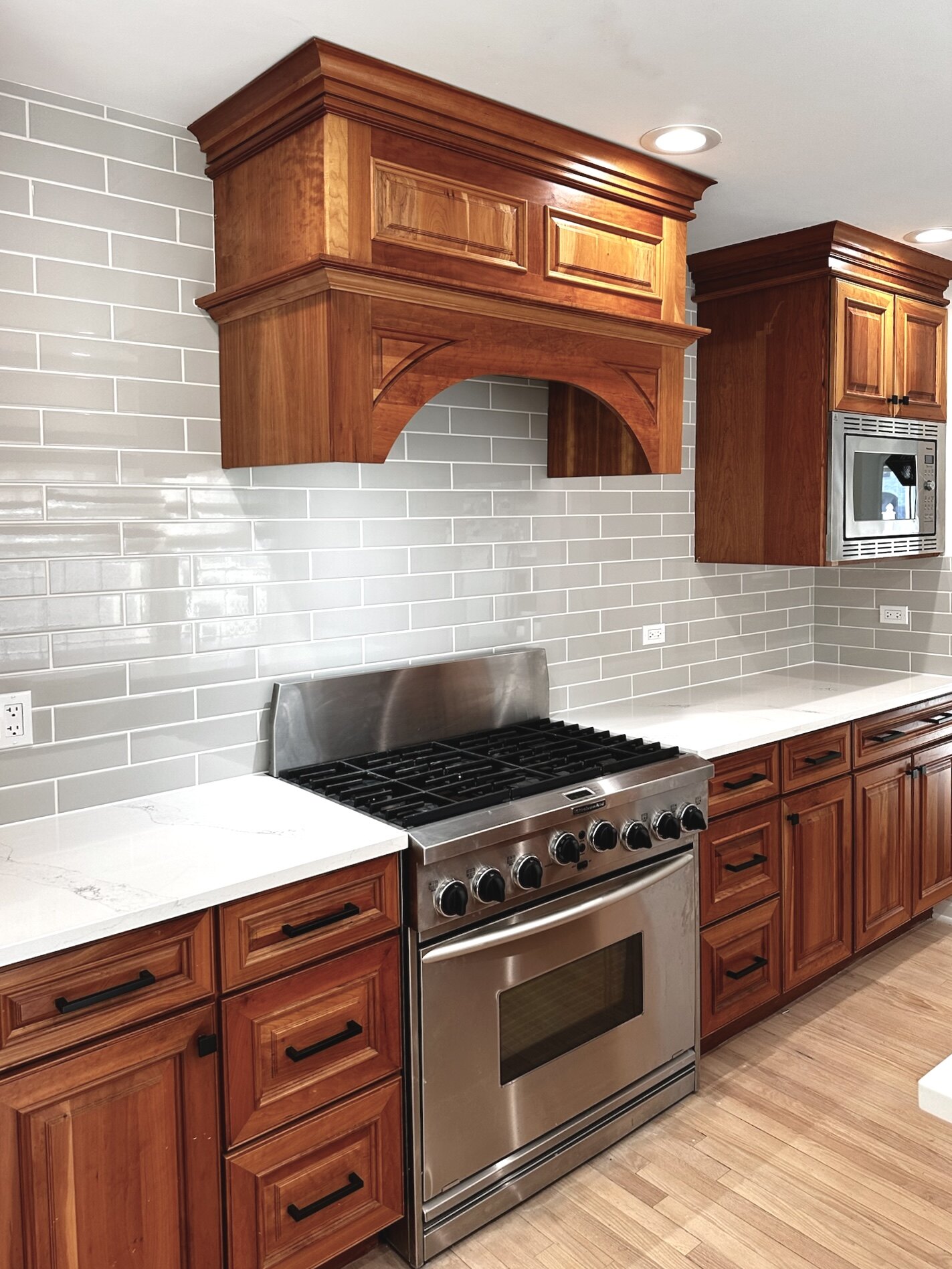 Cherry Wood Kitchen with Quartz Countertops